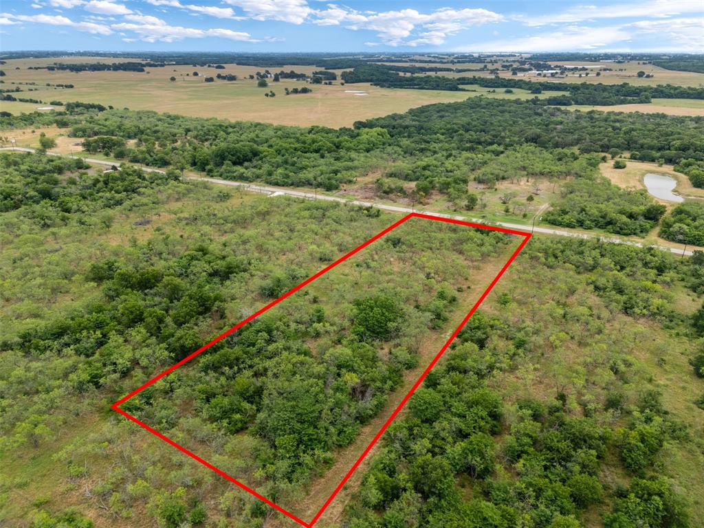 Tbd Lot 89 Tbd Ranch Corsicana, TX 75110 - Photo 2 of 7 a view of a green field with an ocean