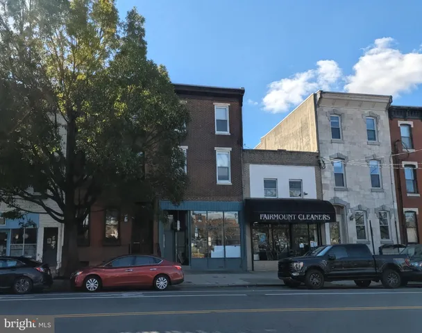 a view of a car parked in front of a building