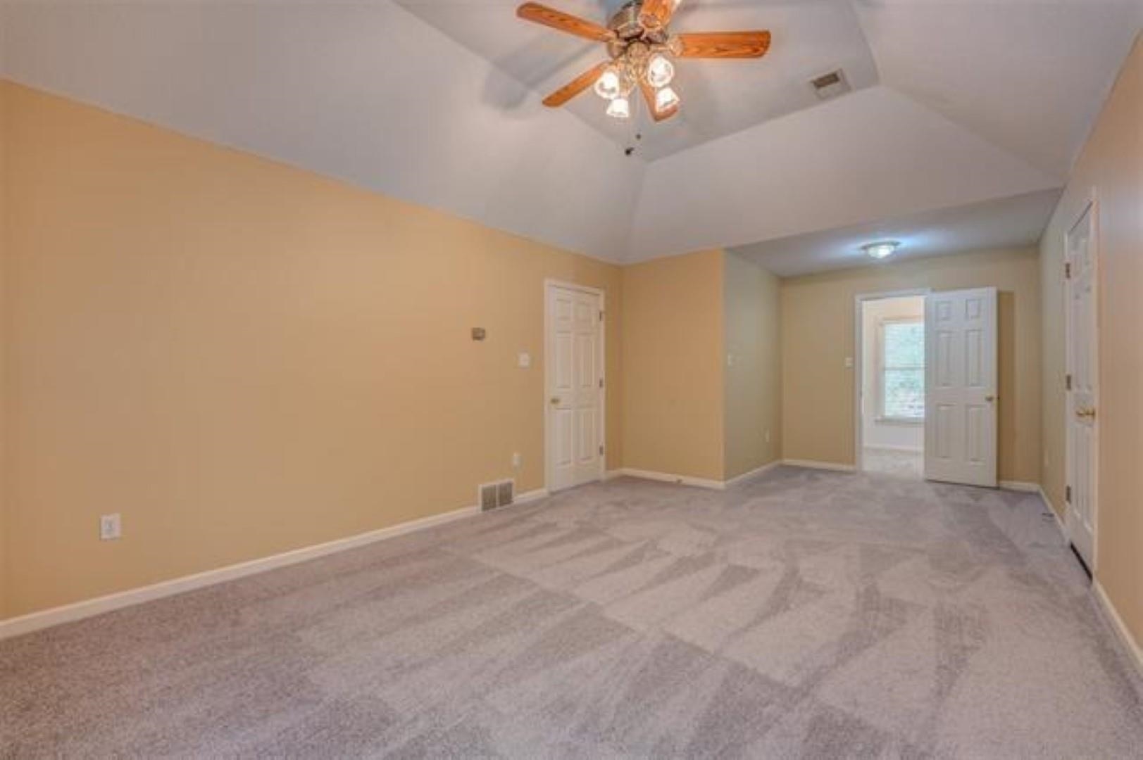 1189 Macon Ridge Drive Collierville, TN 38017 - Photo 13 of 22 an empty room with a ceiling fan and a window