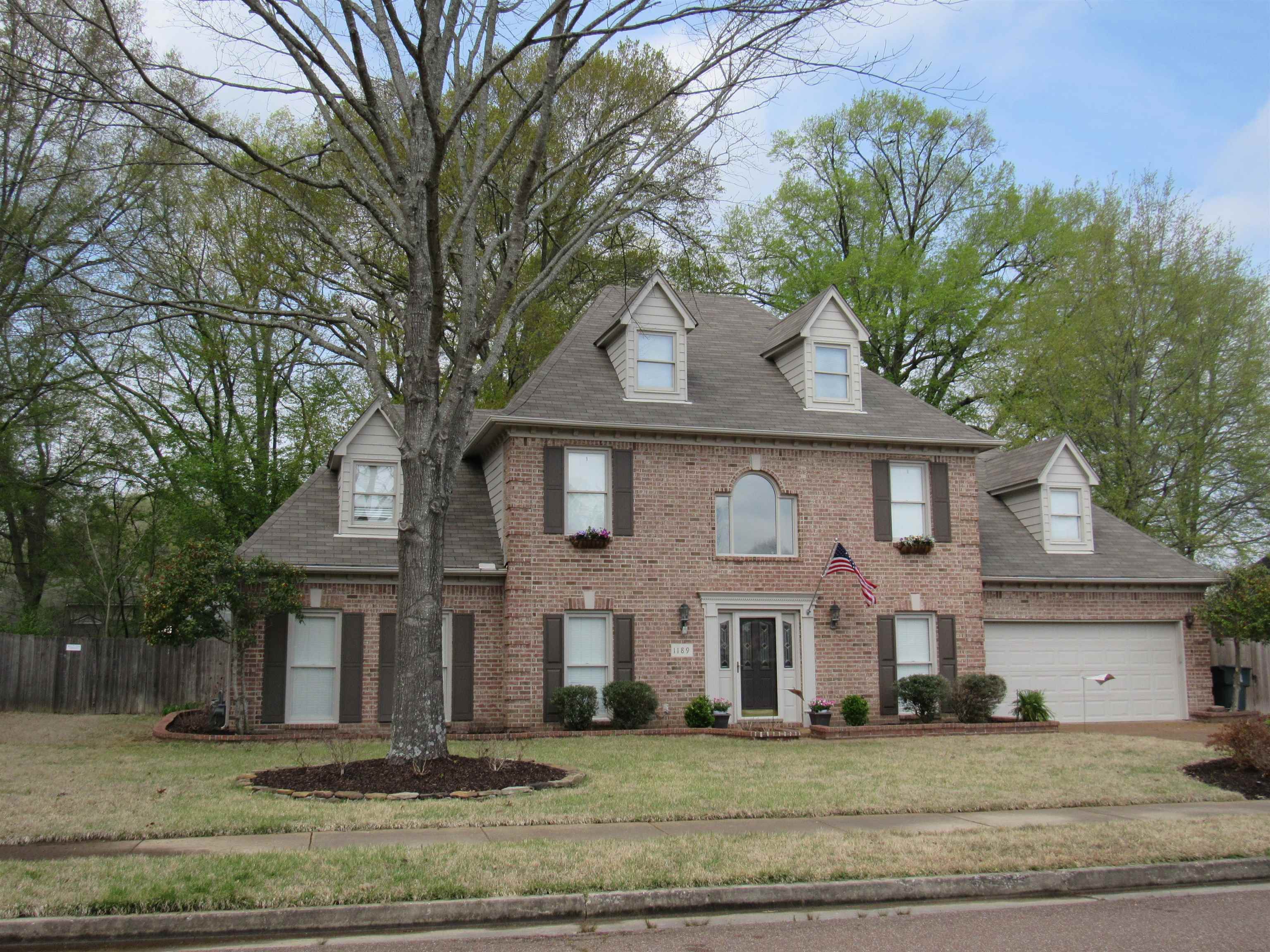 1189 Macon Ridge Drive Collierville, TN 38017 - Photo 19 of 22 a front view of a house with a yard