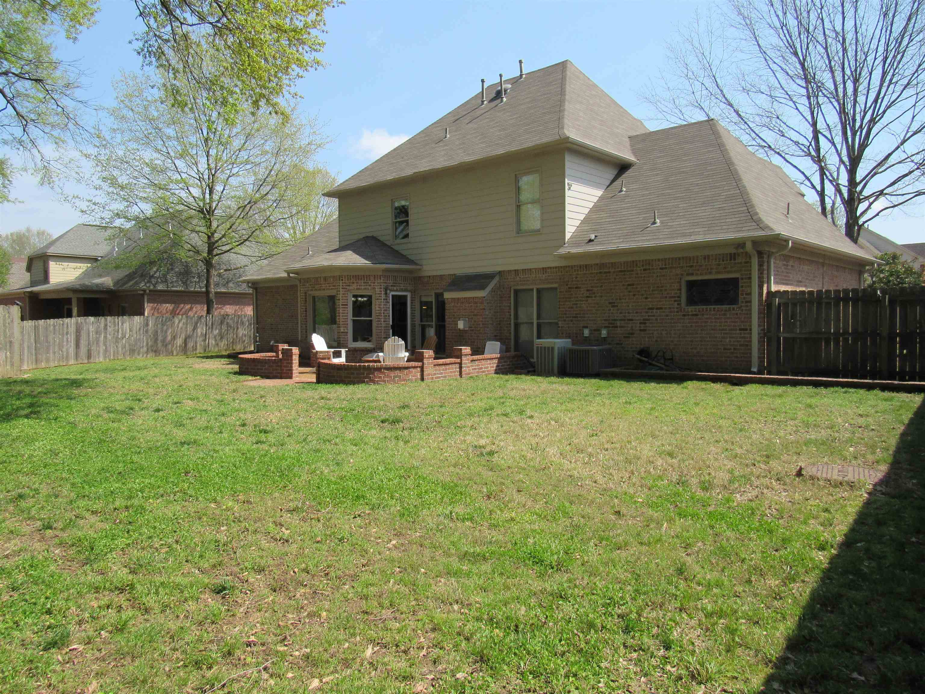 1189 Macon Ridge Drive Collierville, TN 38017 - Photo 20 of 22 a view of a house with a yard and sitting area
