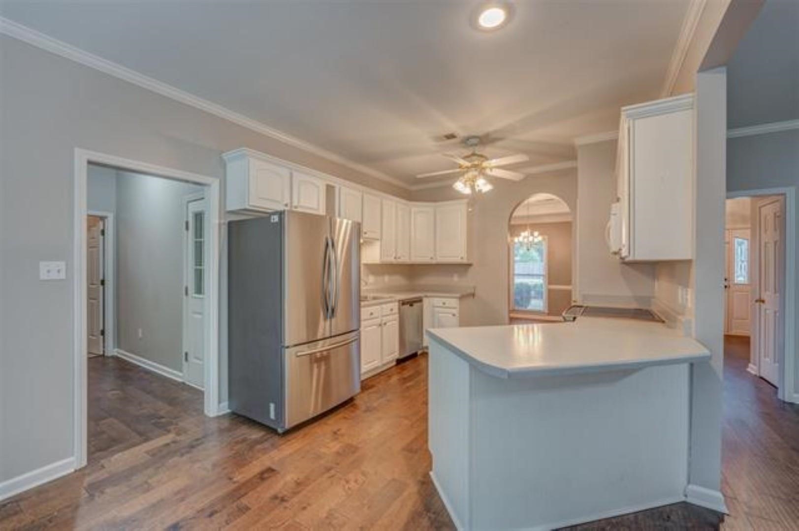 1189 Macon Ridge Drive Collierville, TN 38017 - Photo 8 of 22 a kitchen with stainless steel appliances granite countertop a refrigerator a sink a stove a microwave and island
