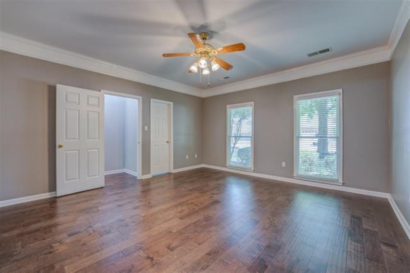 1189 Macon Ridge Drive Collierville, TN 38017 - Photo 10 of 22 a view of an empty room with wooden floor and a window