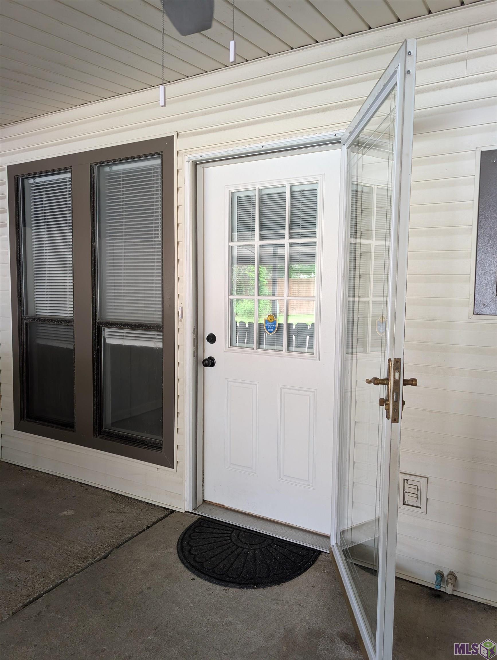 5123 South Oaks Drive Baton Rouge, LA 70816 - Photo 28 of 31 Back Door Under Porch and Carport