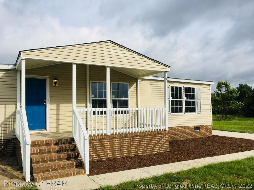 7692 Smithfield Road Godwin, NC 28344 - Photo 2 of 36 front view of a house