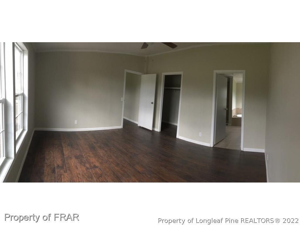 7692 Smithfield Road Godwin, NC 28344 - Photo 22 of 36 a view of an empty room with wooden floor