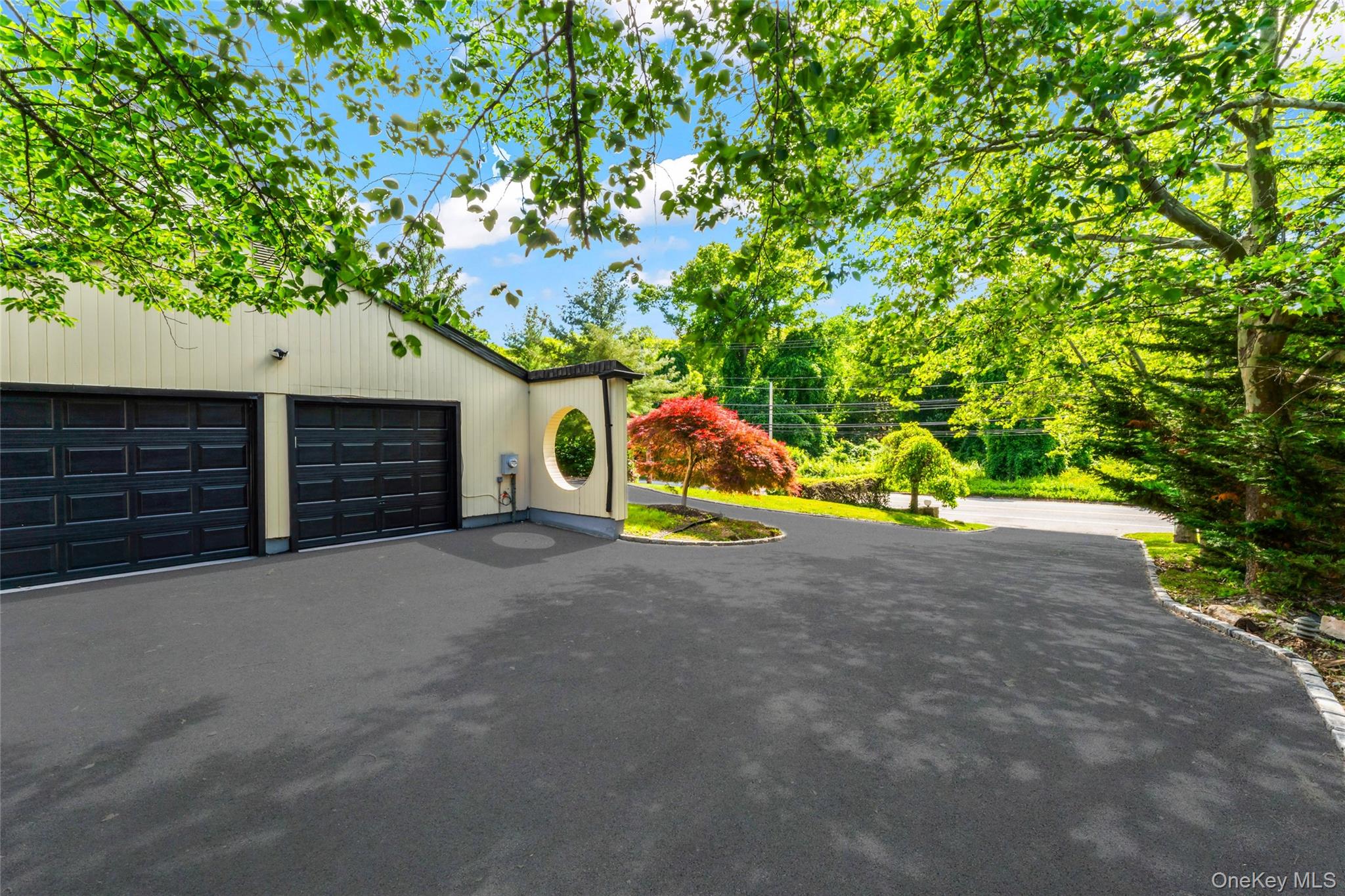 126 Bagatelle Road Melville, NY 11747 - Photo 47 of 50 a view of a house with a yard and garage