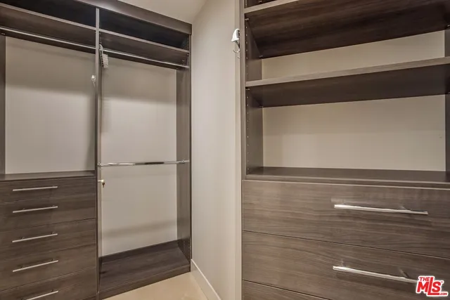 a bedroom with a large bed and a window with outer view