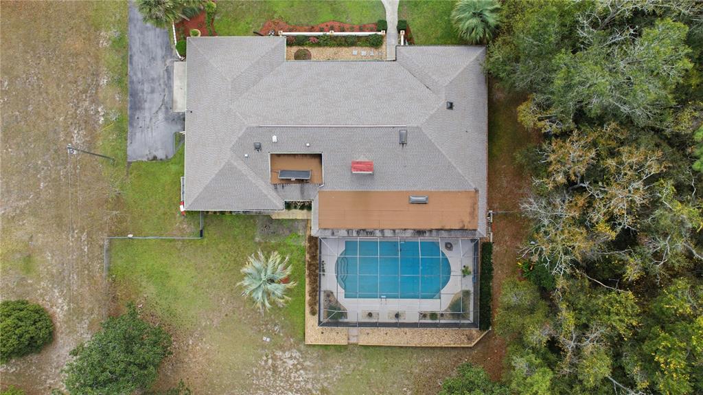 9825 Southwest 202nd Avenue Road Dunnellon, FL 34431 - Photo 11 of 69 an aerial view of a house with a yard