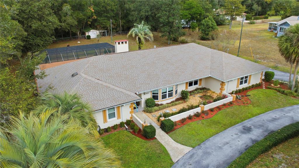9825 Southwest 202nd Avenue Road Dunnellon, FL 34431 - Photo 12 of 69 an aerial view of a house with a yard basket ball court and outdoor seating