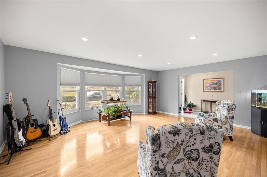 9825 Southwest 202nd Avenue Road Dunnellon, FL 34431 - Photo 17 of 69 a living room with furniture and a large window
