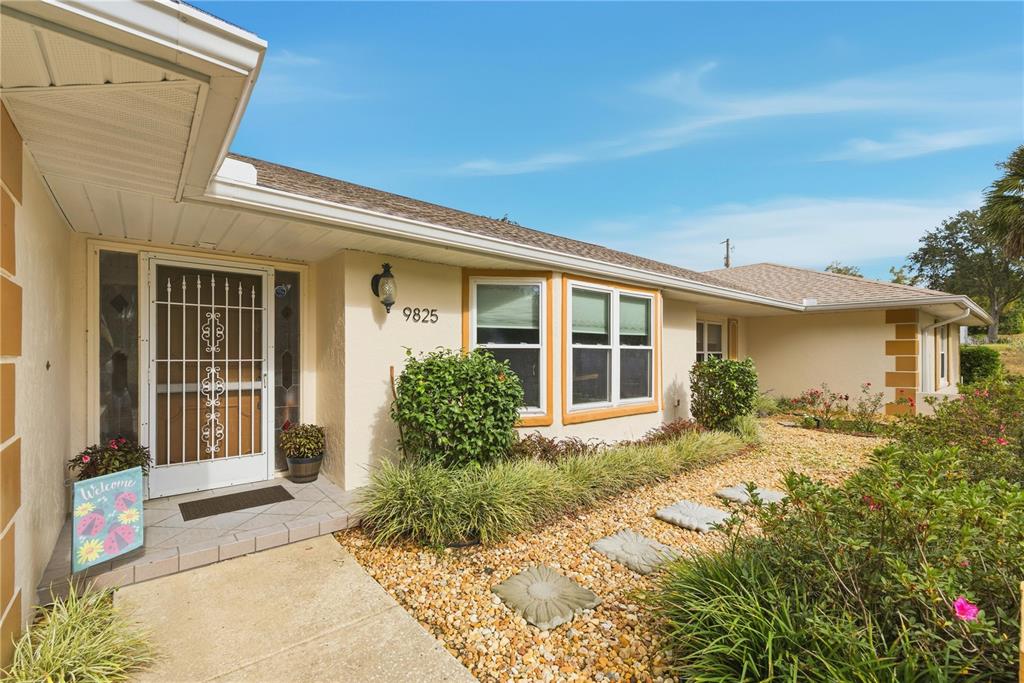9825 Southwest 202nd Avenue Road Dunnellon, FL 34431 - Photo 2 of 69 a front view of a house with a porch