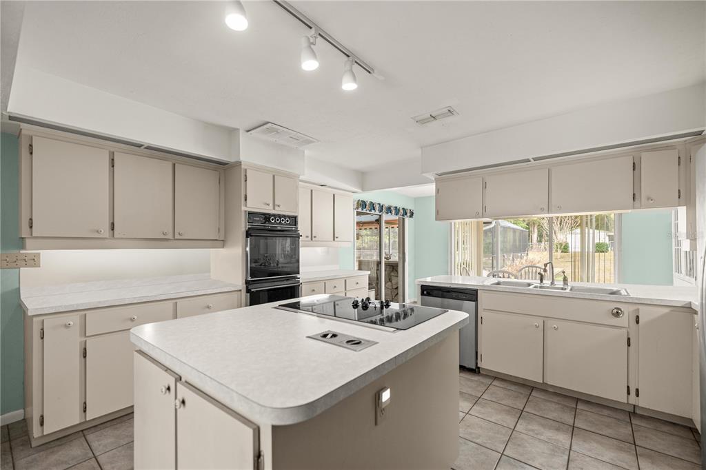 9825 Southwest 202nd Avenue Road Dunnellon, FL 34431 - Photo 23 of 69 a kitchen with a sink and cabinets