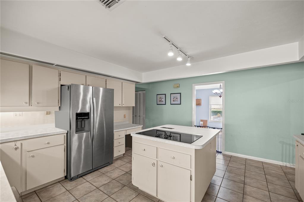 9825 Southwest 202nd Avenue Road Dunnellon, FL 34431 - Photo 24 of 69 a kitchen with a refrigerator and a sink