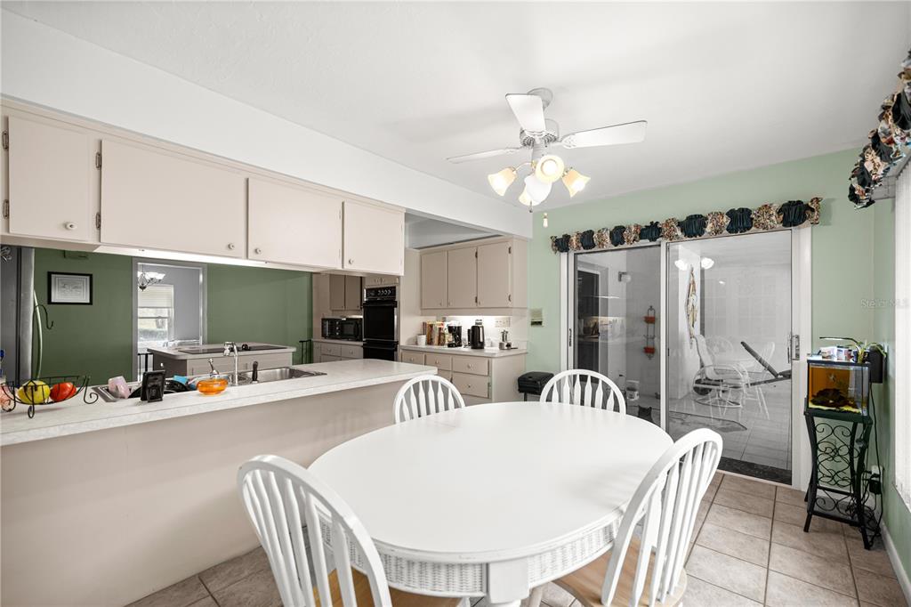 9825 Southwest 202nd Avenue Road Dunnellon, FL 34431 - Photo 26 of 69 a view of a dining room with furniture