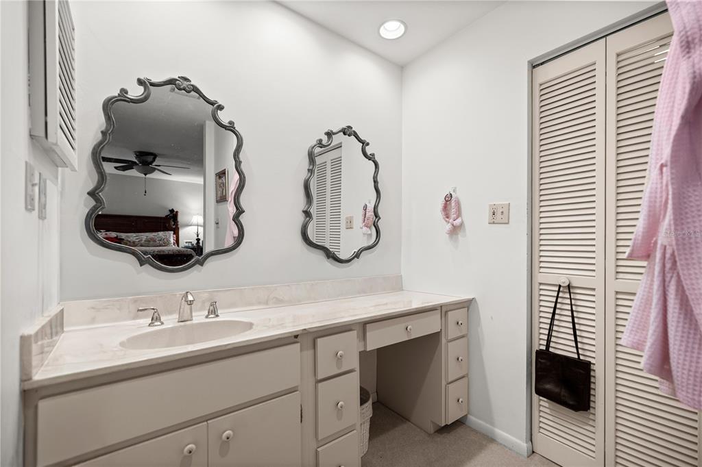 9825 Southwest 202nd Avenue Road Dunnellon, FL 34431 - Photo 32 of 69 a bathroom with a double vanity sink and mirror