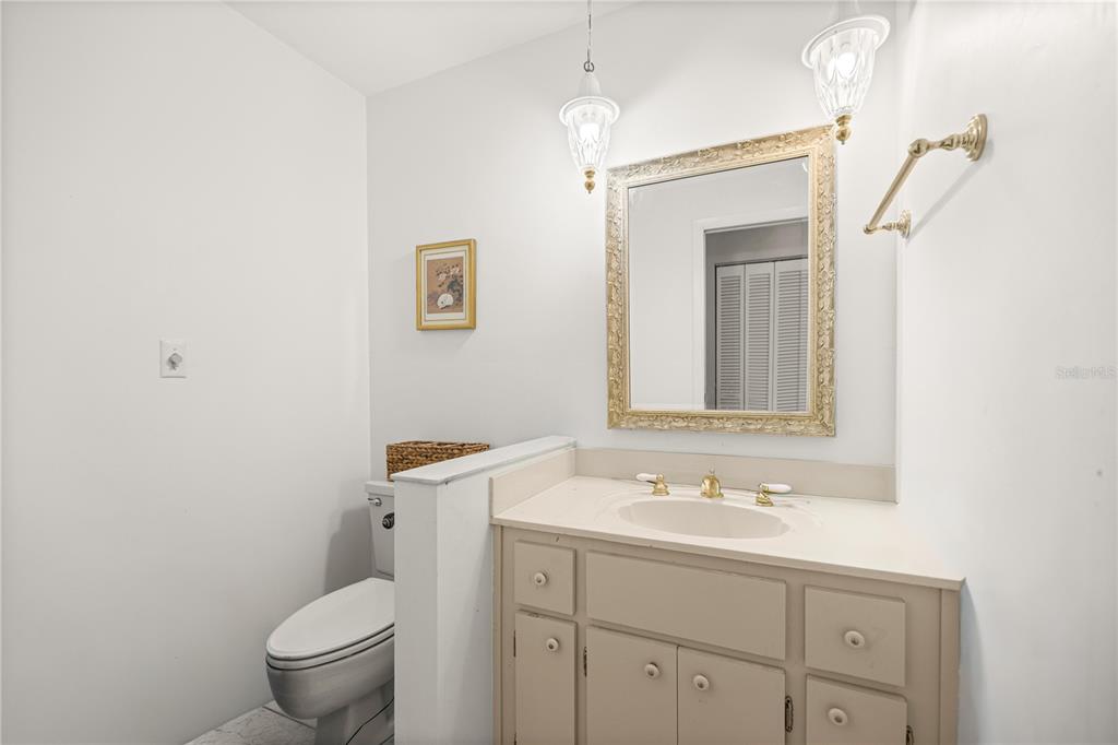 9825 Southwest 202nd Avenue Road Dunnellon, FL 34431 - Photo 38 of 69 a bathroom with a toilet sink and mirror