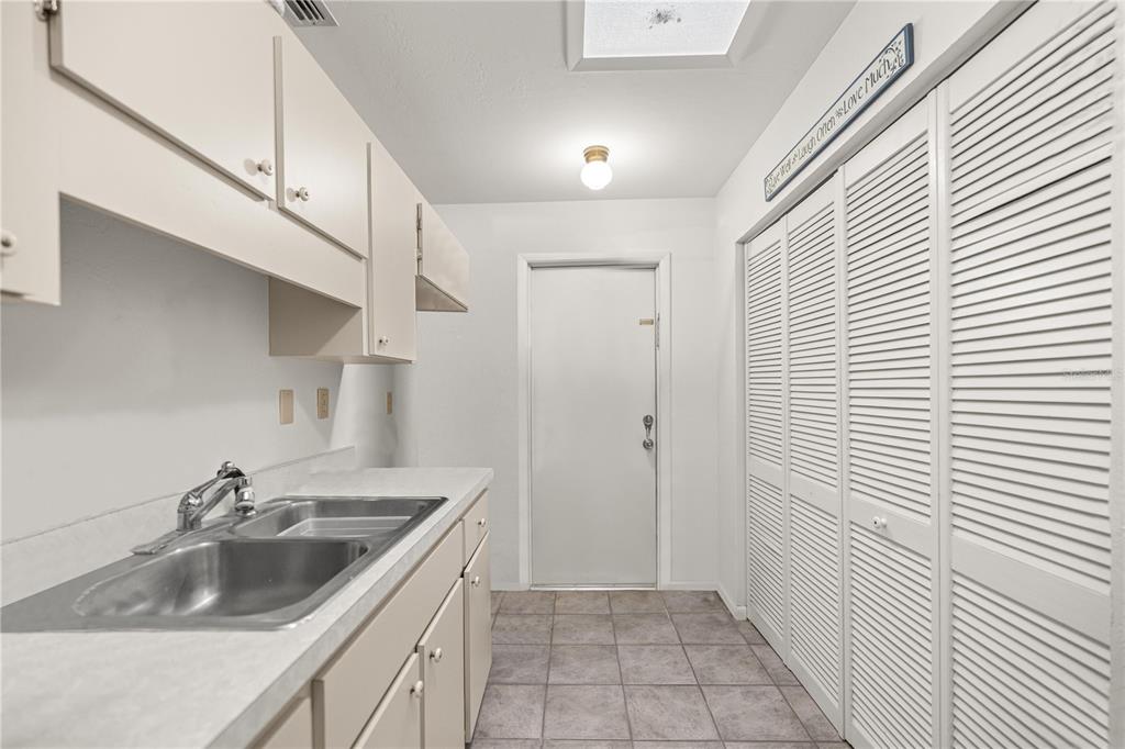 9825 Southwest 202nd Avenue Road Dunnellon, FL 34431 - Photo 39 of 69 a kitchen with a sink cabinets and entryway