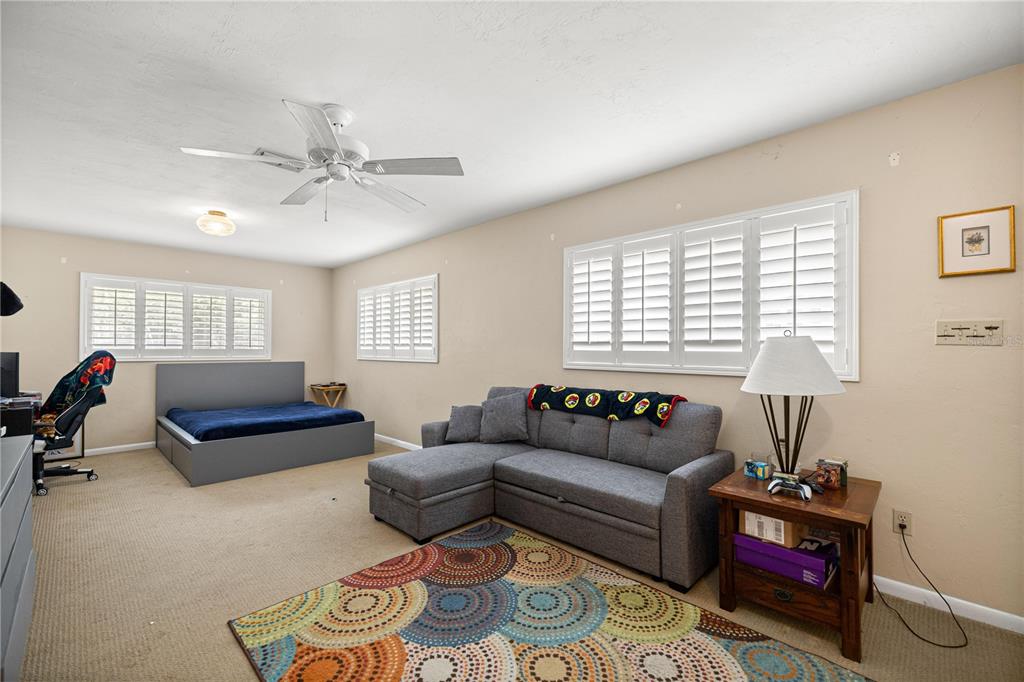 9825 Southwest 202nd Avenue Road Dunnellon, FL 34431 - Photo 41 of 69 a living room with furniture and a window
