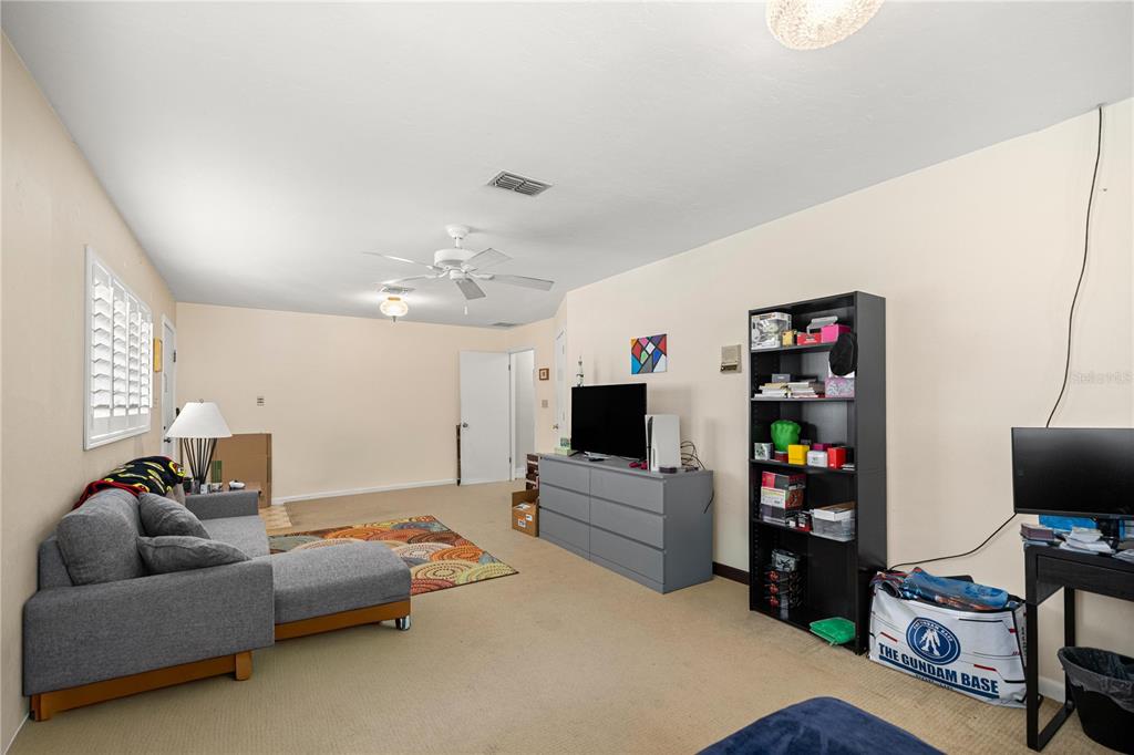 9825 Southwest 202nd Avenue Road Dunnellon, FL 34431 - Photo 42 of 69 a living room with furniture and a flat screen tv