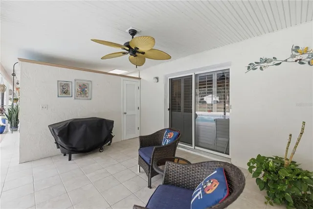 a view of a patio with furniture and a yard