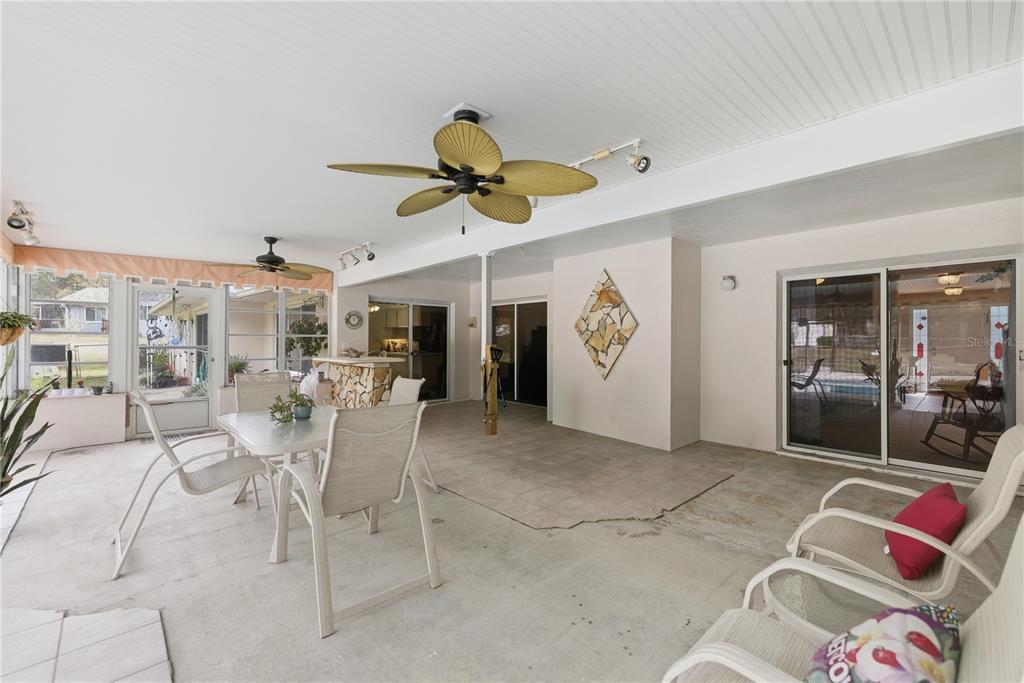 9825 Southwest 202nd Avenue Road Dunnellon, FL 34431 - Photo 52 of 69 a view of a livingroom with furniture and a ceiling fan