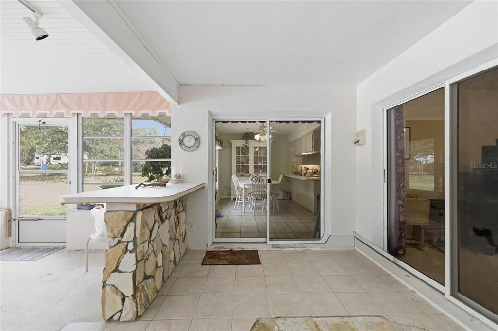 9825 Southwest 202nd Avenue Road Dunnellon, FL 34431 - Photo 53 of 69 a room with lots of wooden furniture and a shower