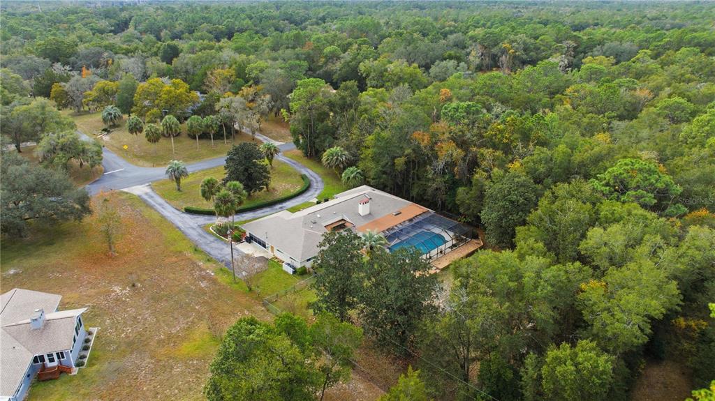 9825 Southwest 202nd Avenue Road Dunnellon, FL 34431 - Photo 10 of 69 an aerial view of a house with a yard