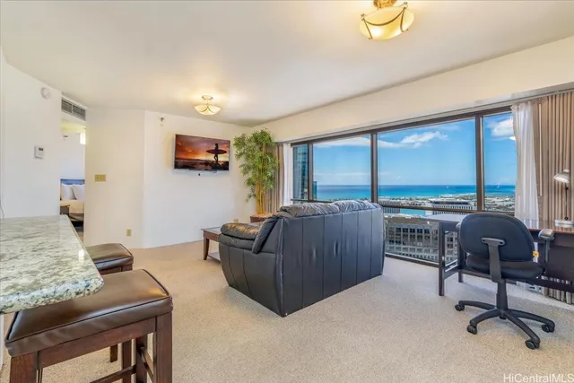 a living room with furniture and a large window