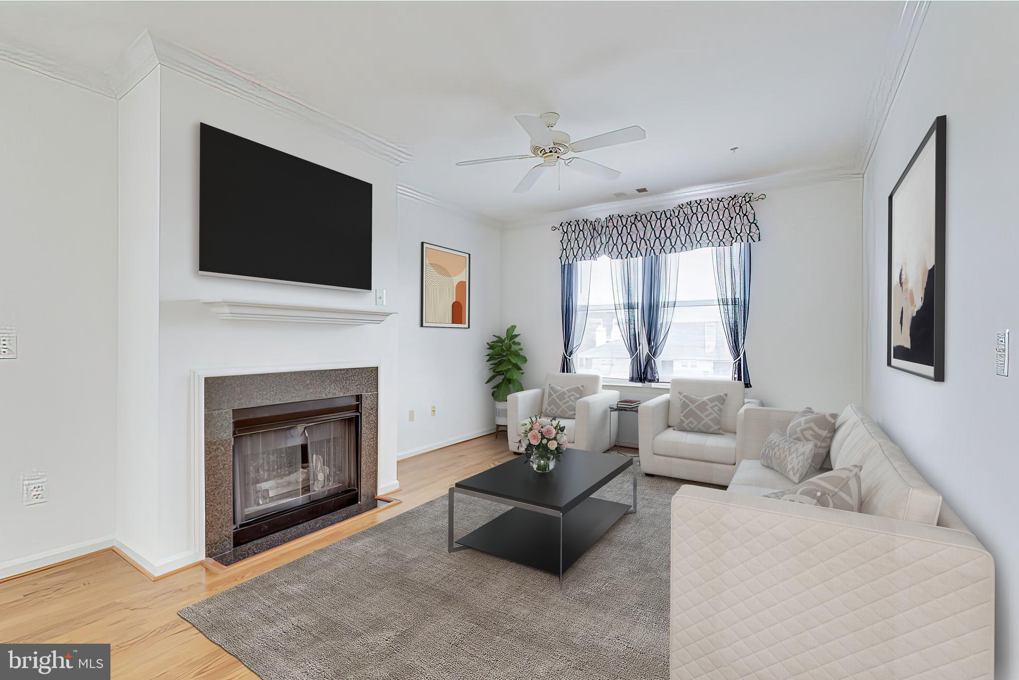 12000 Market Street, Unit 370 Reston, VA 20190 - Photo 10 of 51 gas fireplace - virtual staging