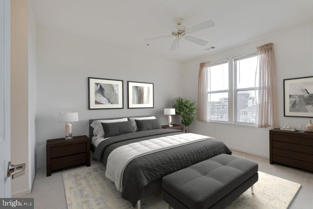 12000 Market Street, Unit 370 Reston, VA 20190 - Photo 20 of 35 a bedroom with a bed and wooden floor