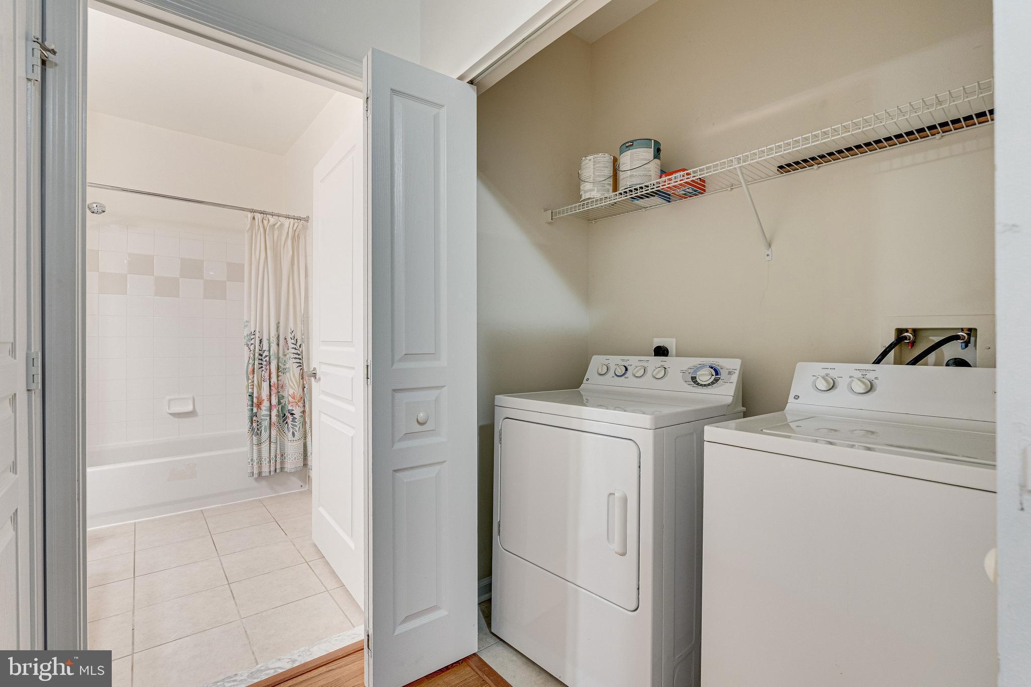 12000 Market Street, Unit 370 Reston, VA 20190 - Photo 27 of 51 a view of storage and utility room with washer and dryer