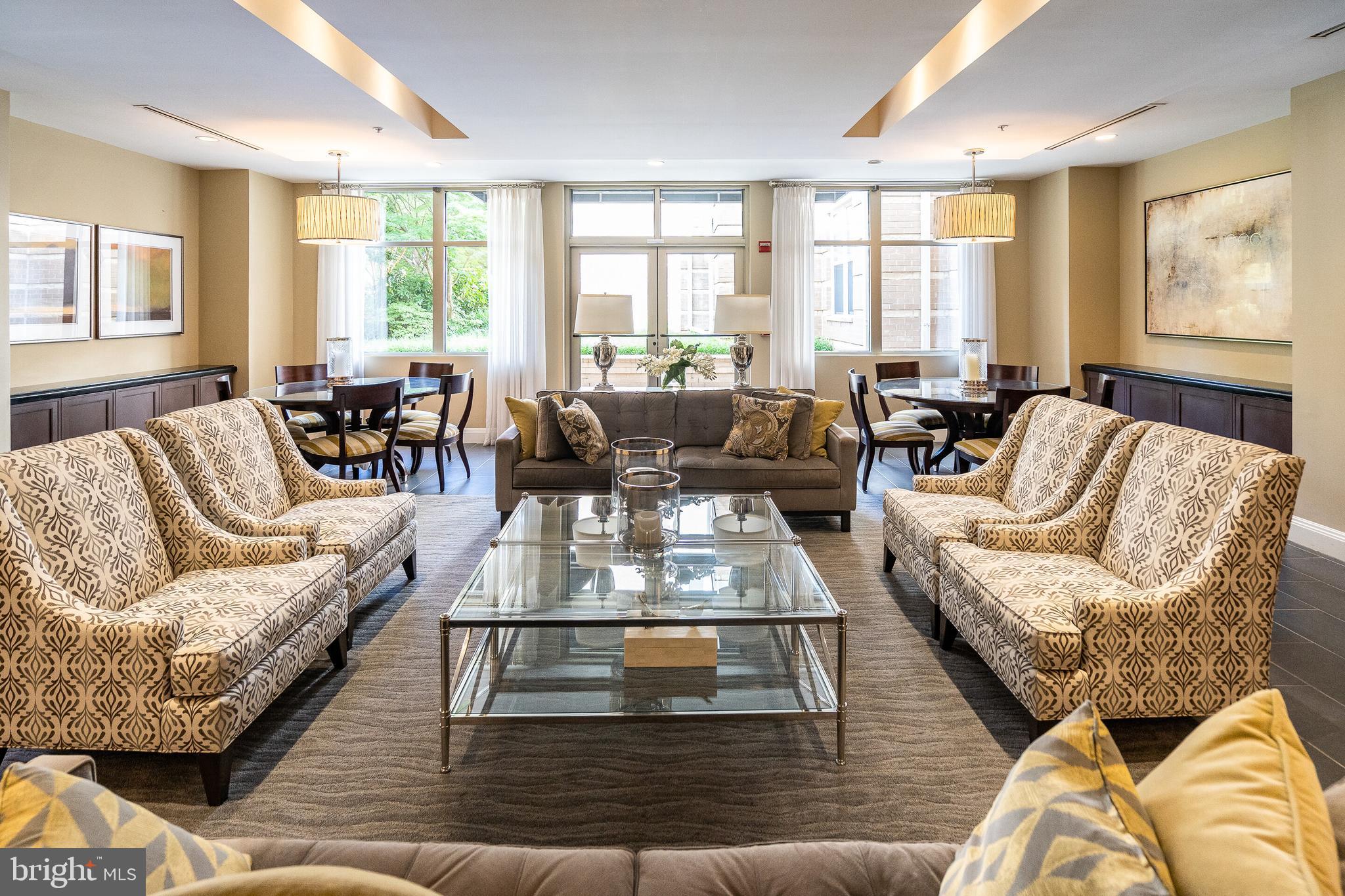 12000 Market Street, Unit 370 Reston, VA 20190 - Photo 29 of 51 a living room with furniture wooden floor and a large window