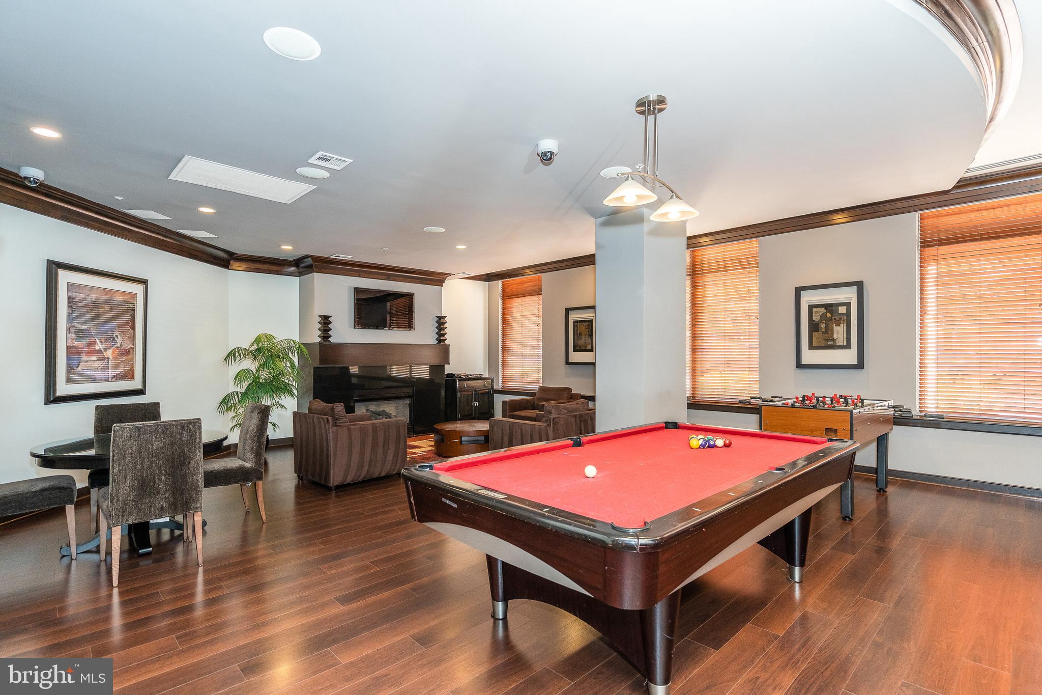 12000 Market Street, Unit 370 Reston, VA 20190 - Photo 31 of 51 a room with pool table and windows