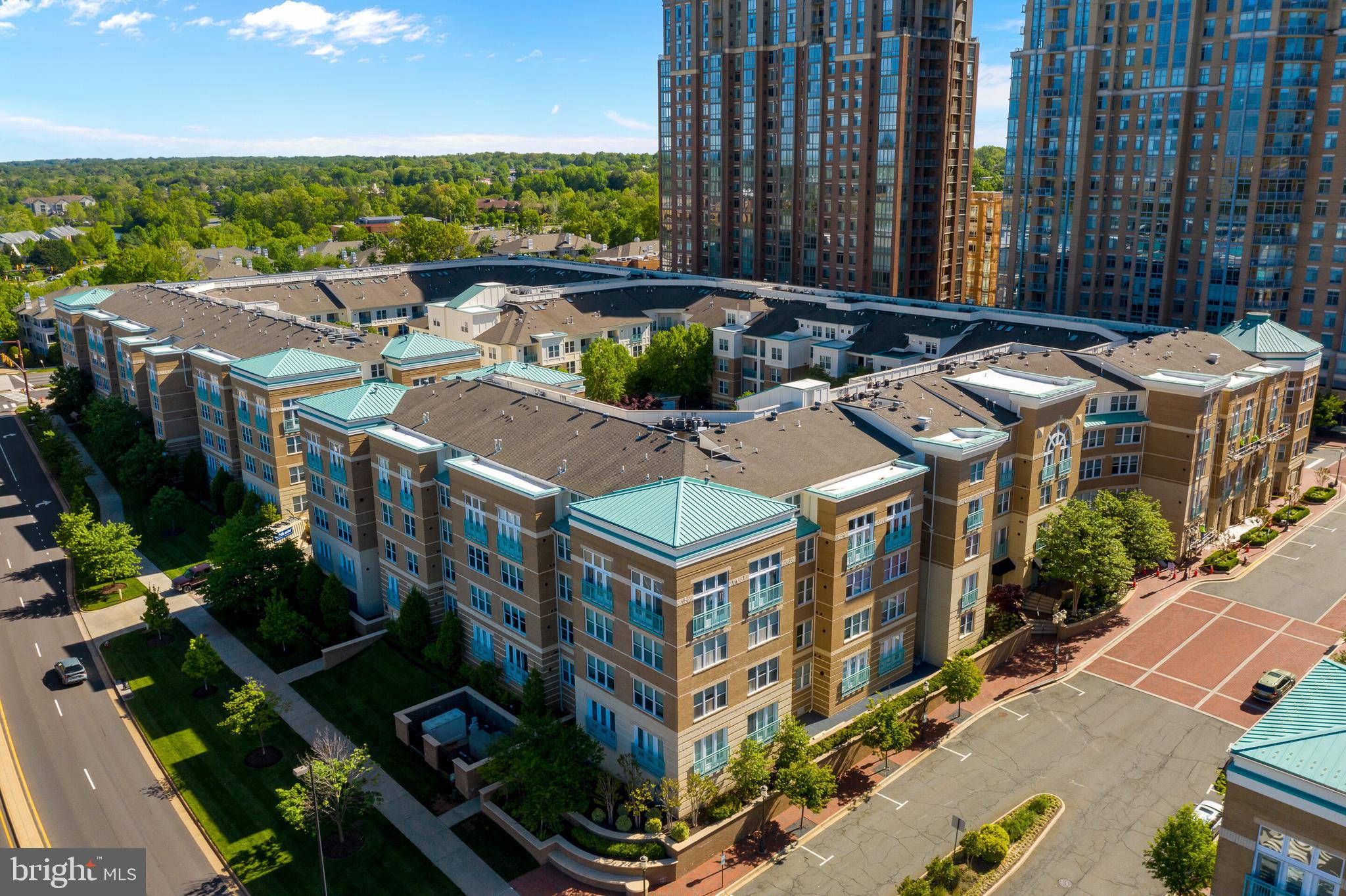 12000 Market Street, Unit 370 Reston, VA 20190 - Photo 43 of 51 an aerial view of residential houses with outdoor space and street view