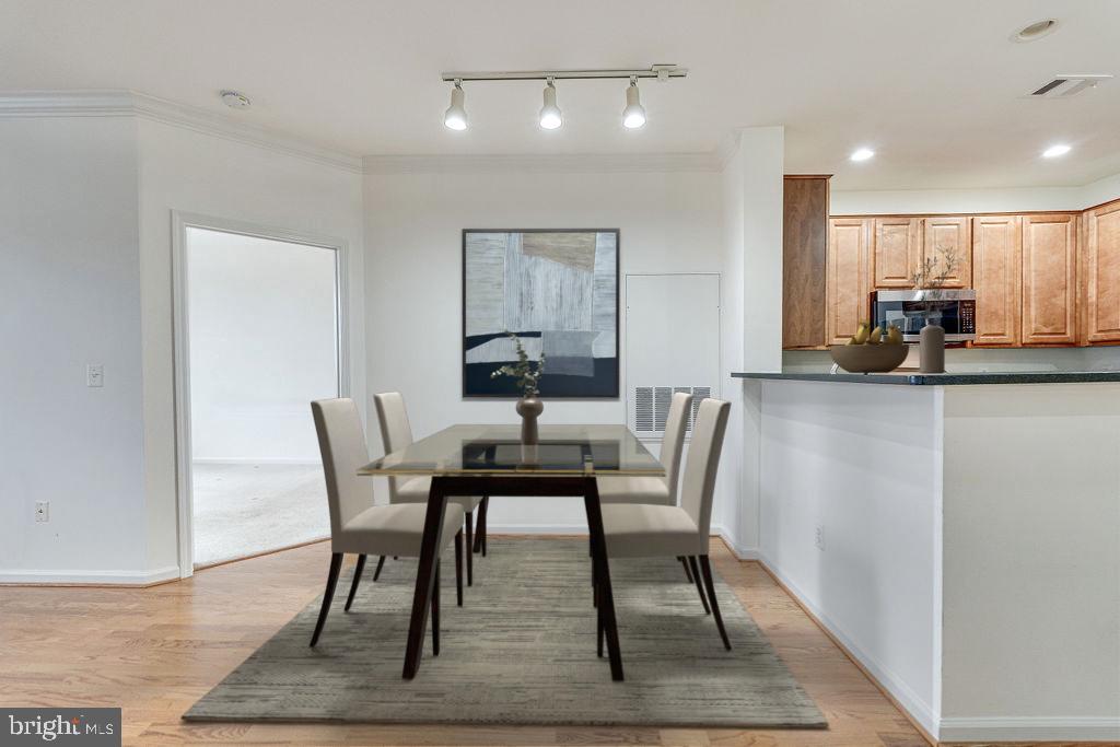 12000 Market Street, Unit 370 Reston, VA 20190 - Photo 7 of 35 a view of a dining room with furniture