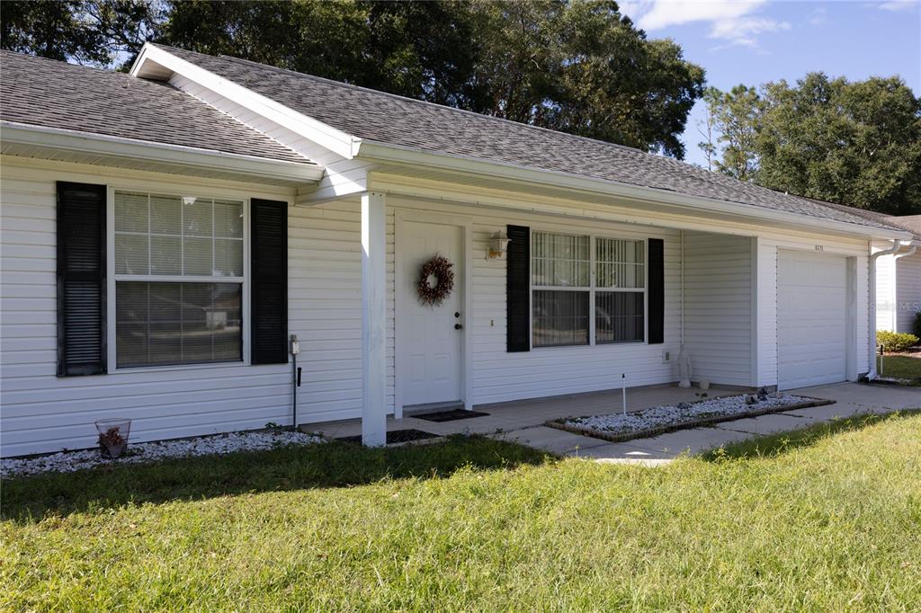 8372 Southwest 65th Avenue Ocala, FL 34476 - Photo 1 of 1 a front view of a house with a yard