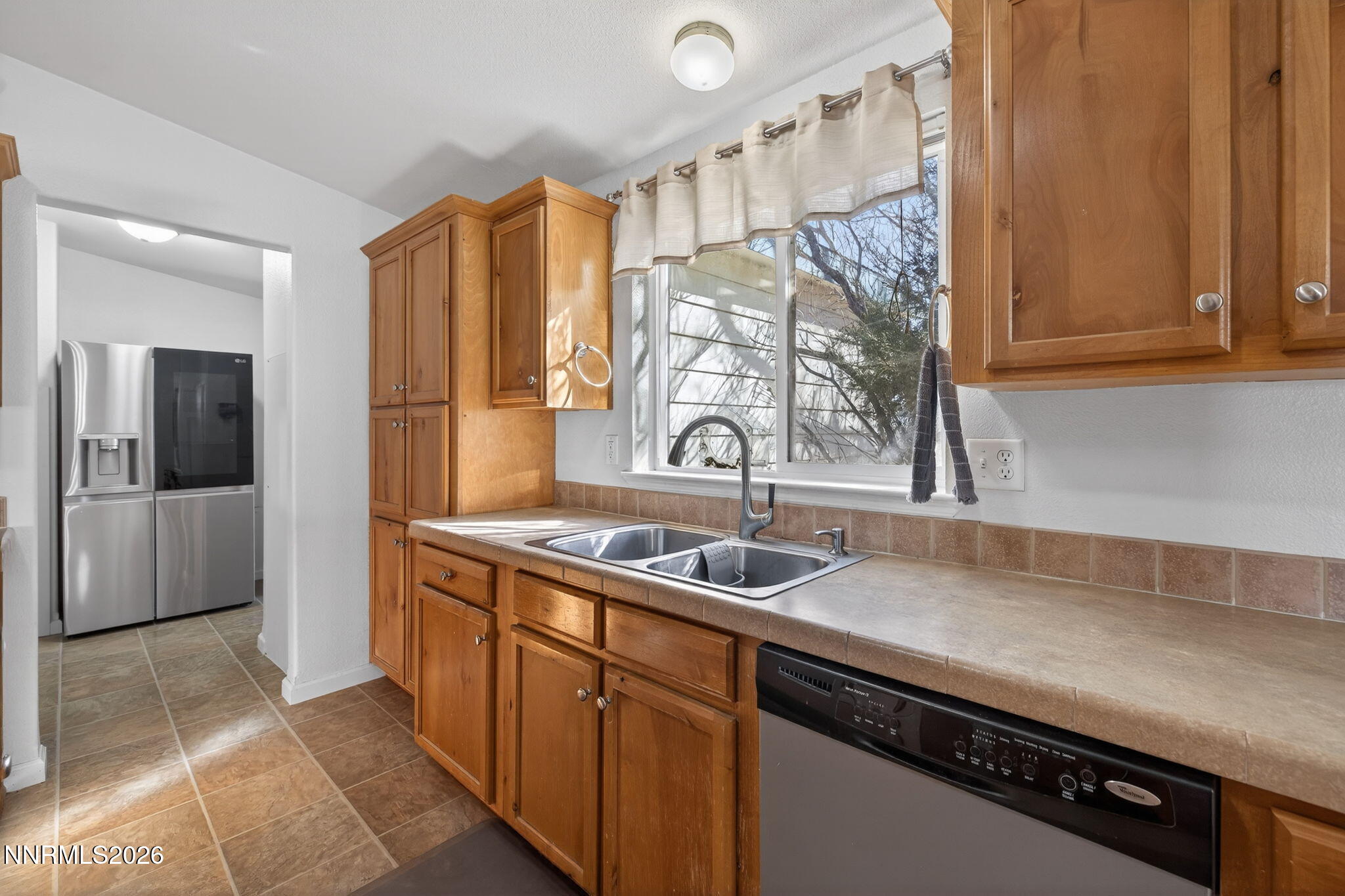 5430 Cox Road Fallon, NV 89406 - Photo 12 of 50 a kitchen with a sink and a refrigerator
