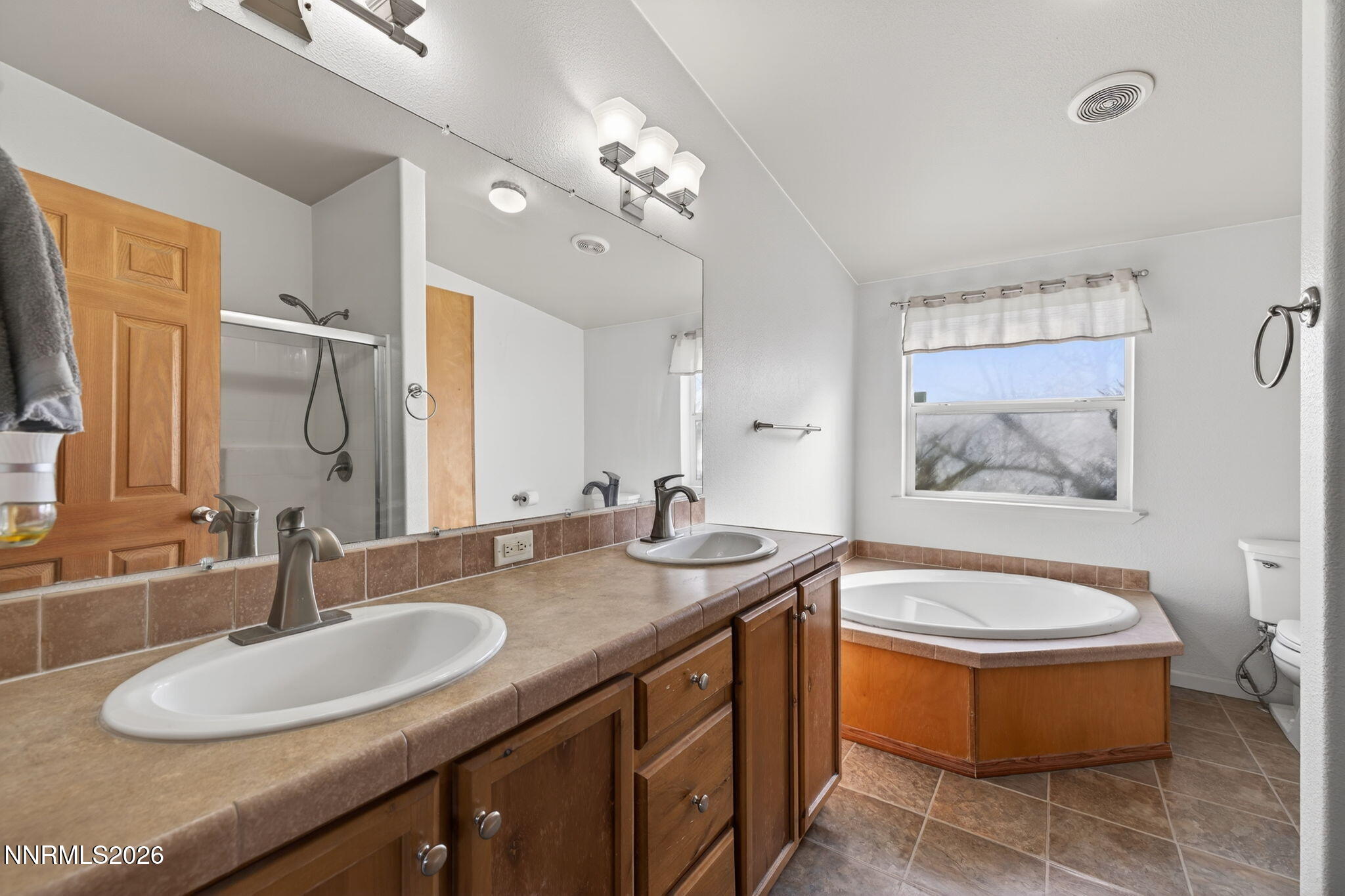 5430 Cox Road Fallon, NV 89406 - Photo 14 of 50 a bathroom with a granite countertop sink and a mirror
