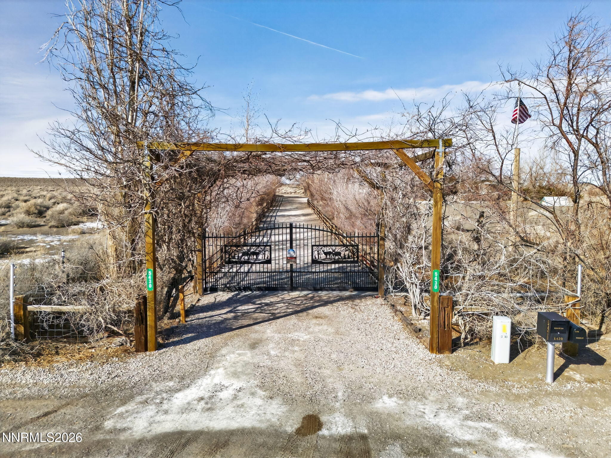 5430 Cox Road Fallon, NV 89406 - Photo 36 of 50 a view of a house with a yard covered with snow in the background
