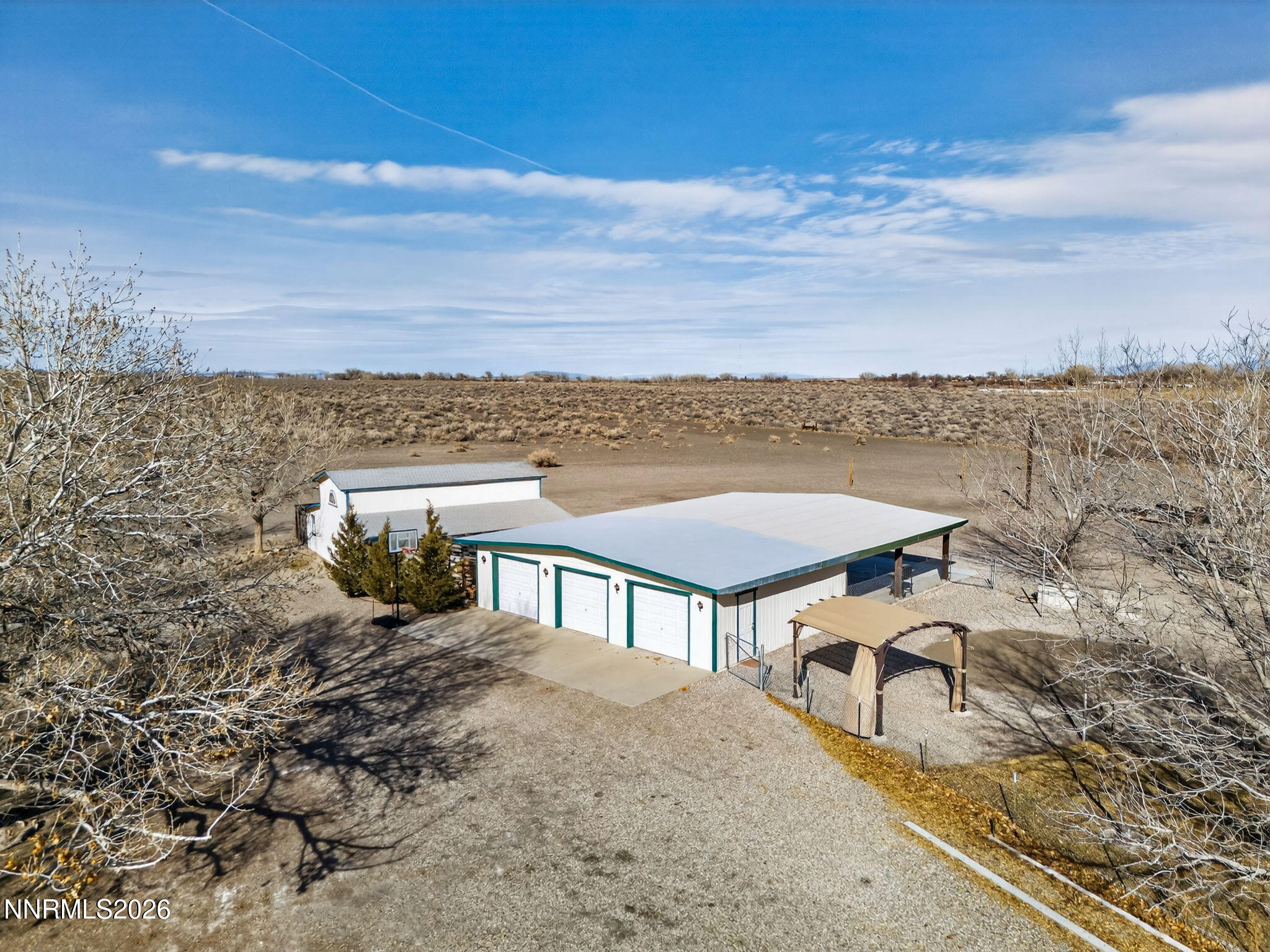 5430 Cox Road Fallon, NV 89406 - Photo 42 of 50 a view of a terrace with a table and chairs under an umbrella