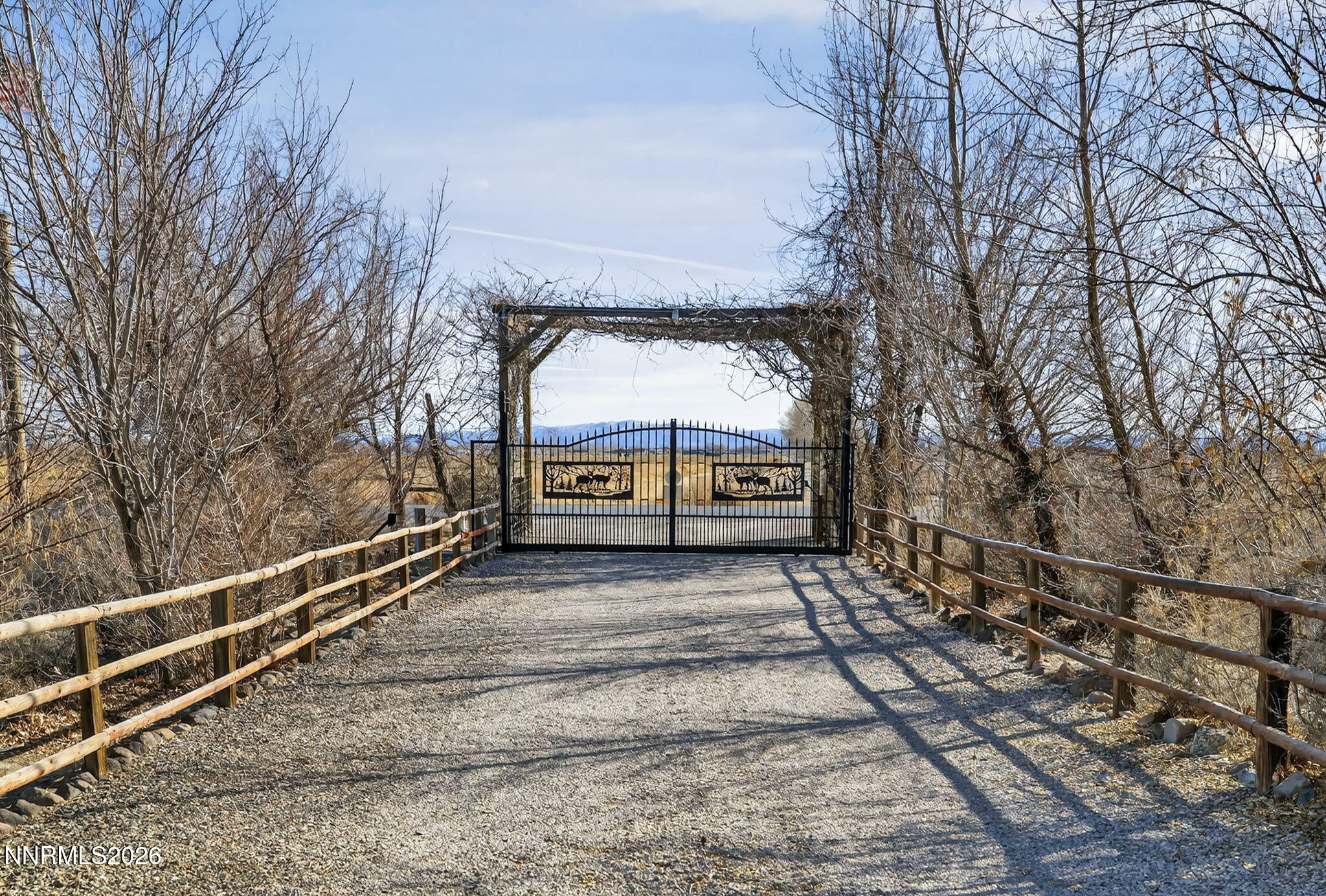 5430 Cox Road Fallon, NV 89406 - Photo 6 of 50 a view of a yard with wooden fence and a bench