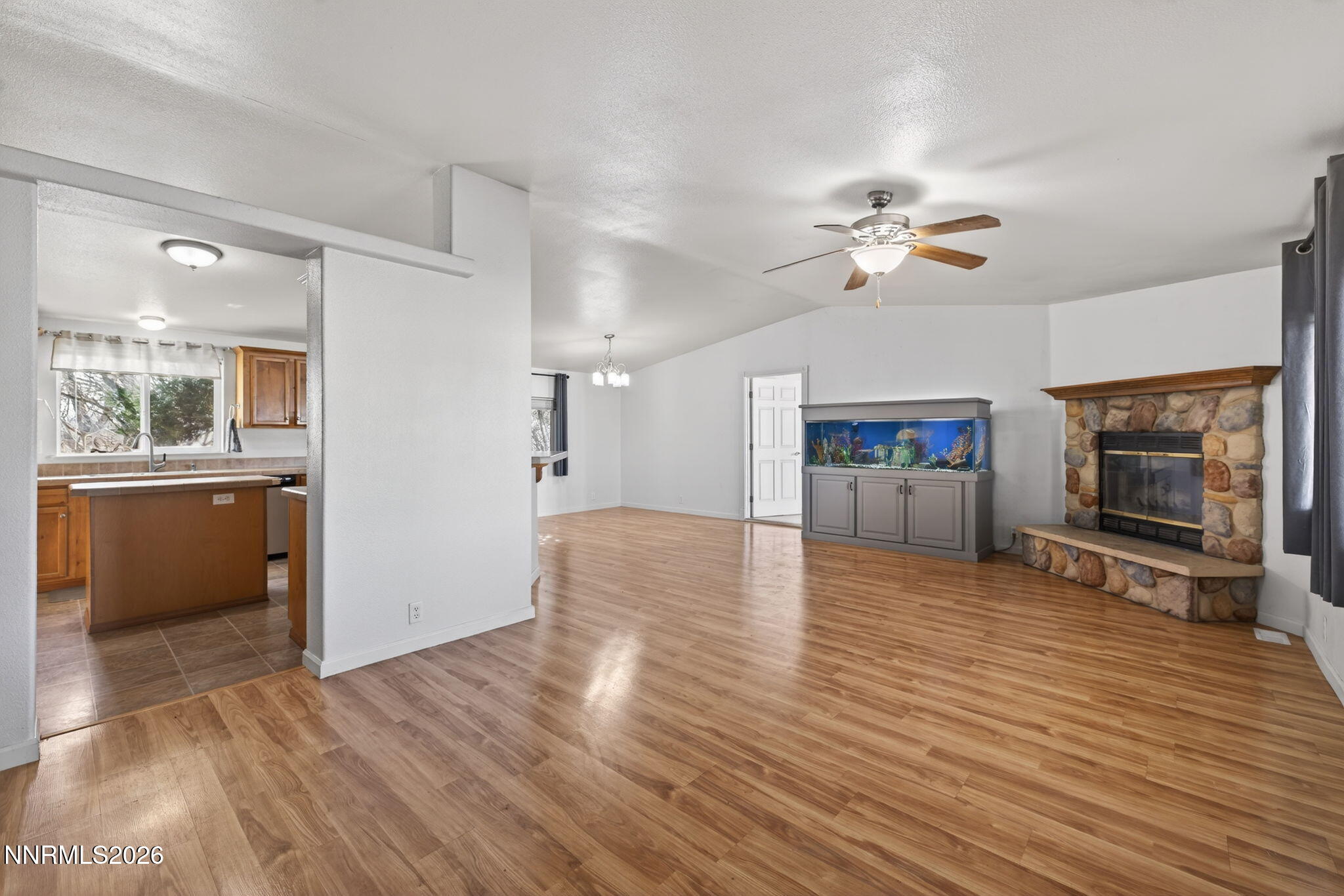 5430 Cox Road Fallon, NV 89406 - Photo 9 of 50 a view of a livingroom with wooden floor and a kitchen