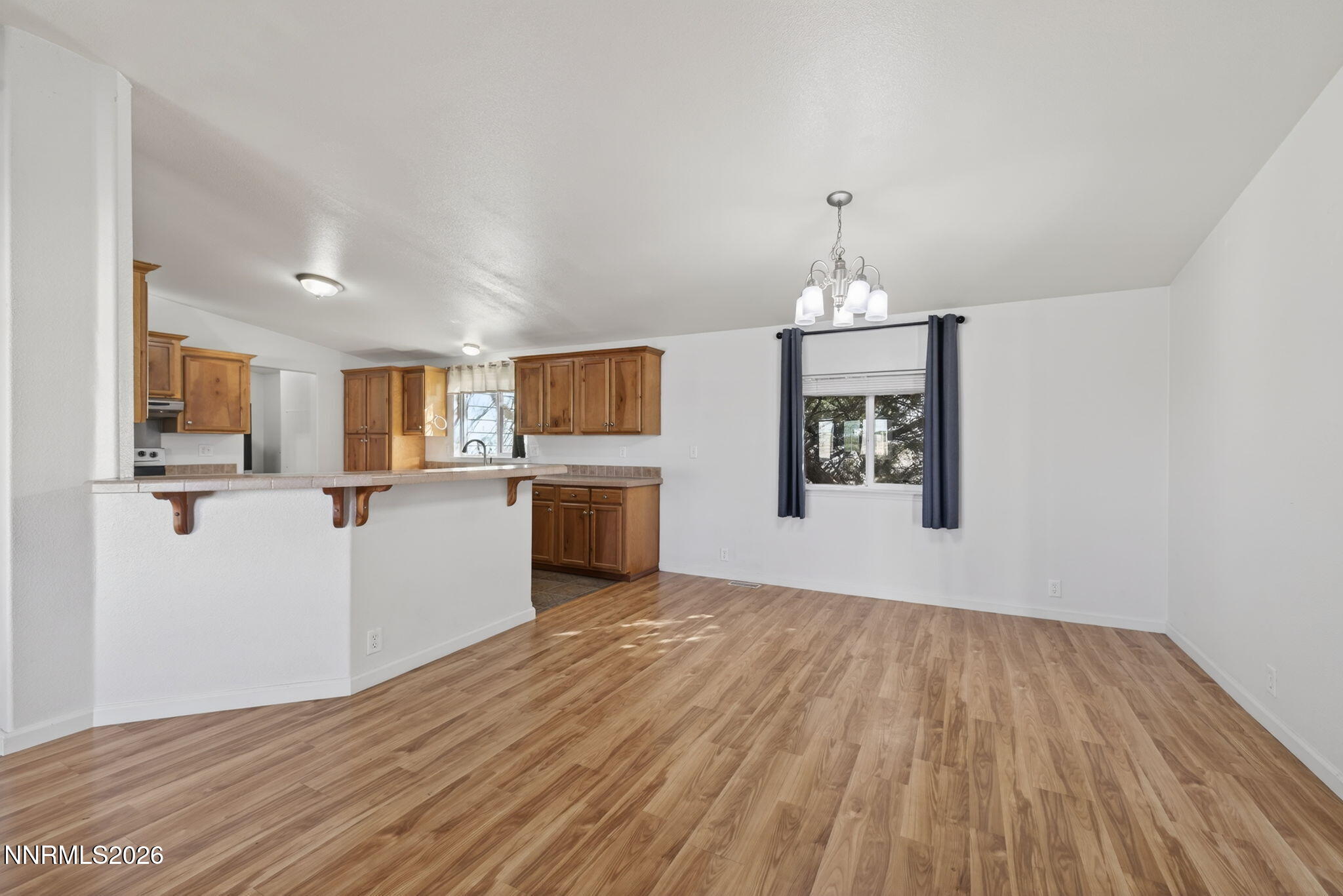 5430 Cox Road Fallon, NV 89406 - Photo 10 of 50 a view of a kitchen with a sink cabinets and wooden floor