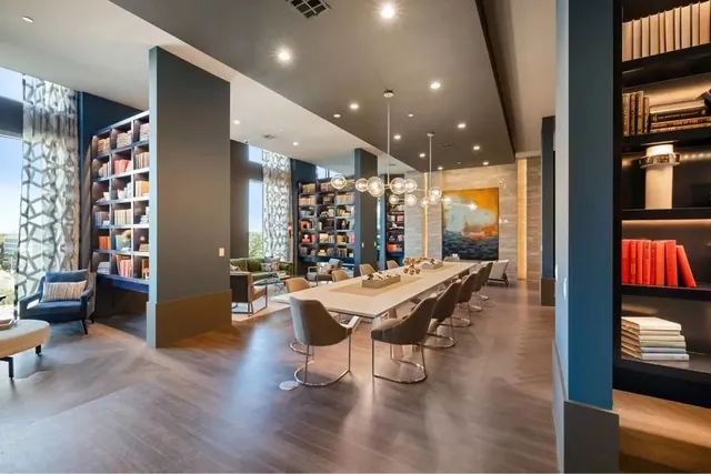 a living room with patio furniture and a flat screen tv