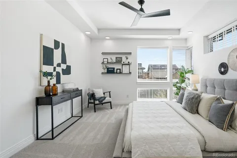 a bedroom with furniture and a window