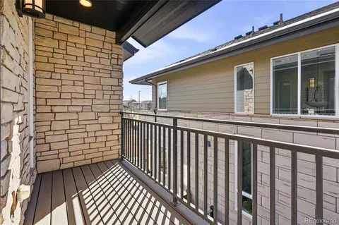 a view of a balcony with wooden floor
