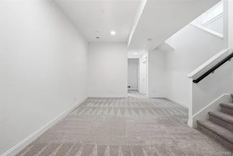 a view of an empty room with stairs