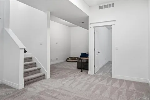a view of a hallway with staircase