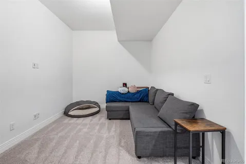 a view of a livingroom with furniture and wooden floor